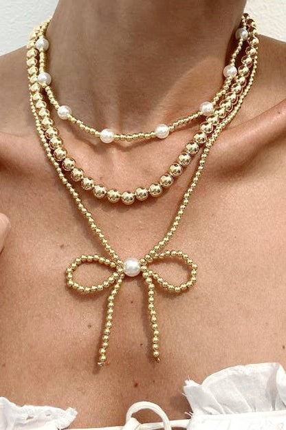 MULTILAYER GOLD PEARL BOW NECKLACE