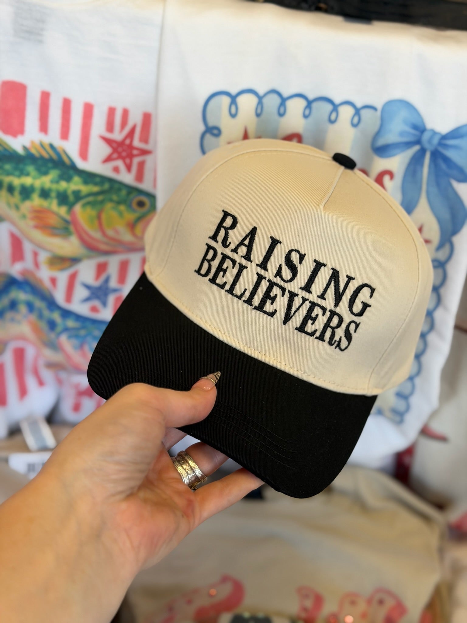 RAISING BELIEVERS TRUCKER HAT