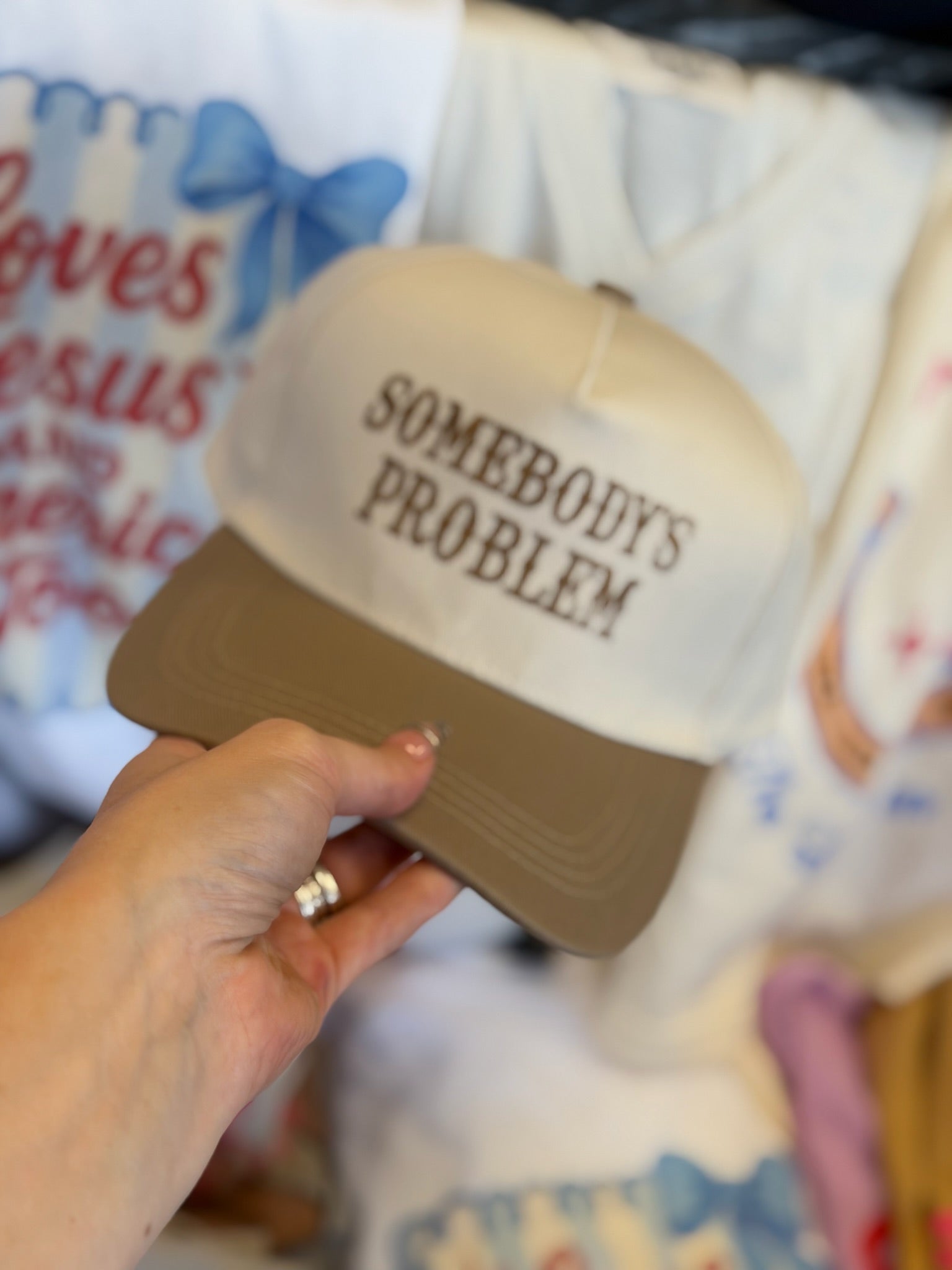 SOMEBODYS PROBLEM TRUCKER HAT