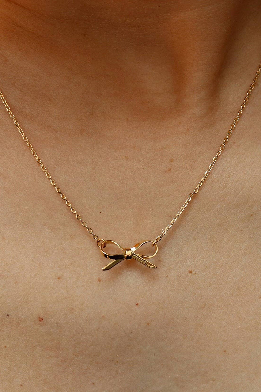 GOLD BOW NECKLACE