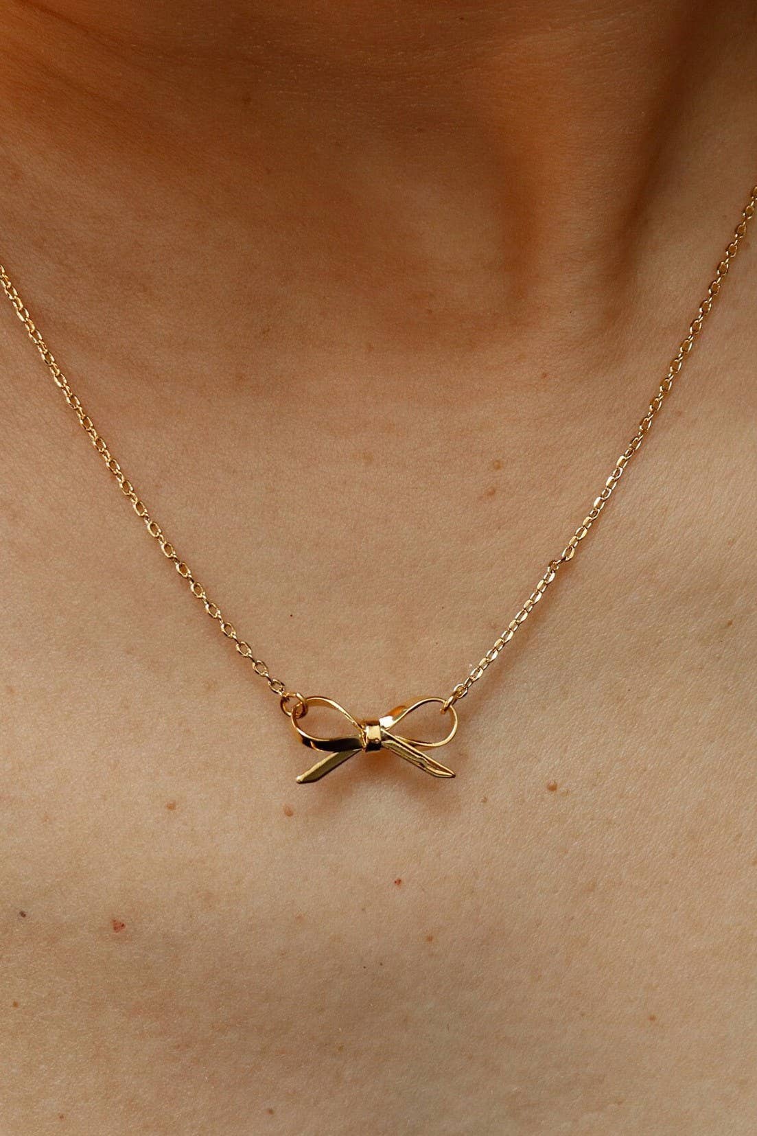 GOLD BOW NECKLACE